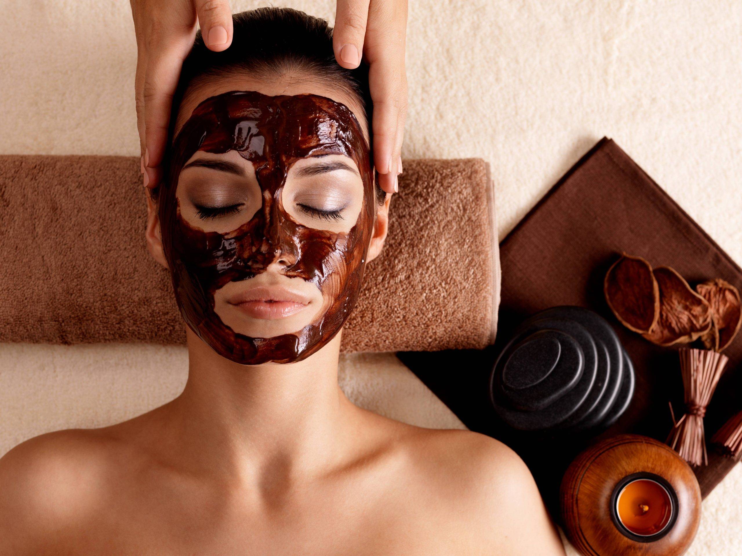 spa massage young woman with facial mask face indoors 1 scaled